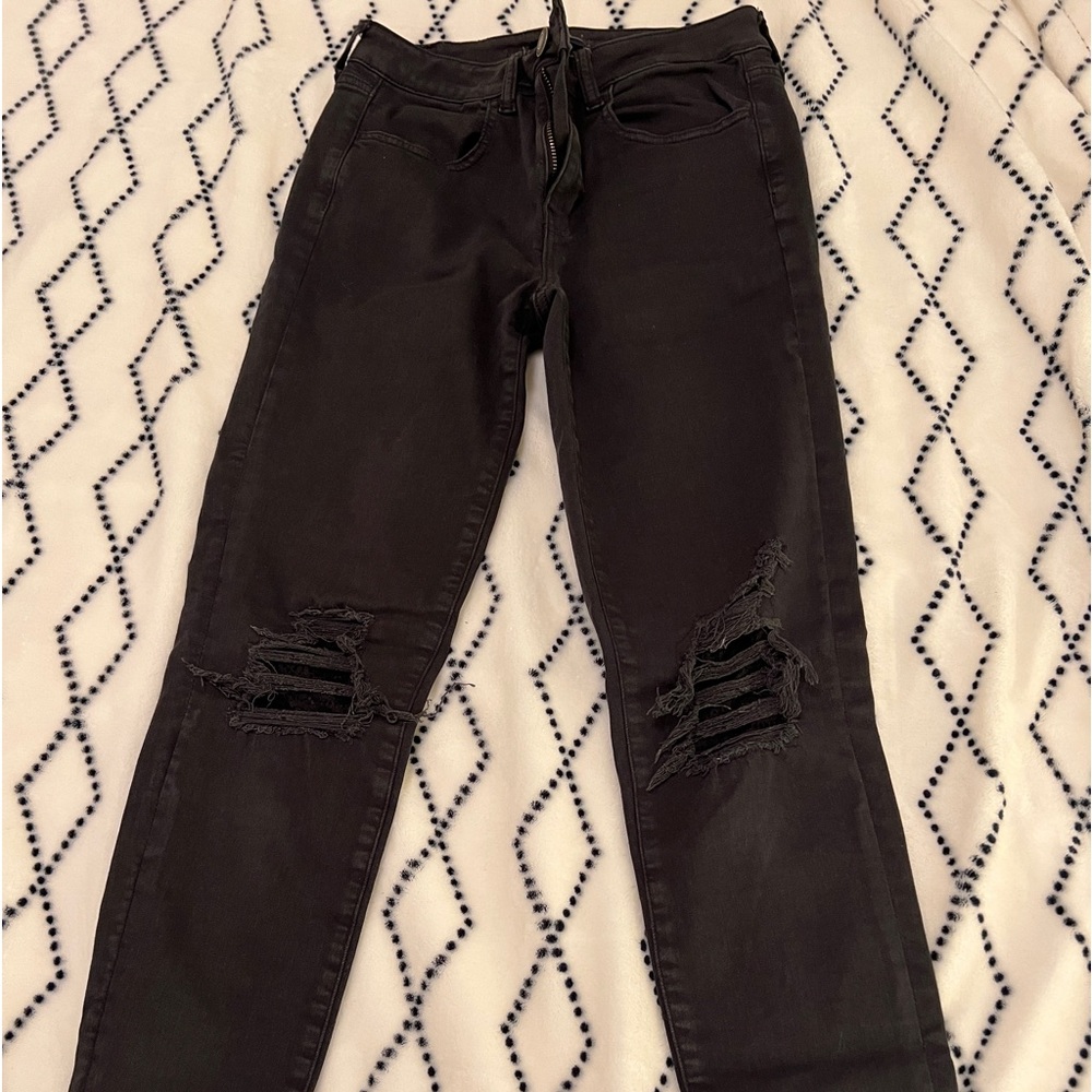black american eagle skinny jeans with lace rips in the knee